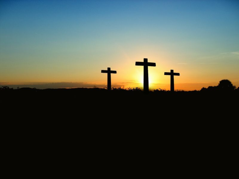 Photo of 3 crosses aginst the backdrop of a sunset on the Church of Christ Santa Clara SCCOC website