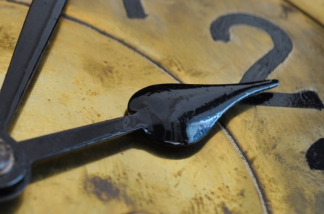 Extreme close up of clock hands in an article by the Church of Christ at Santa Clara